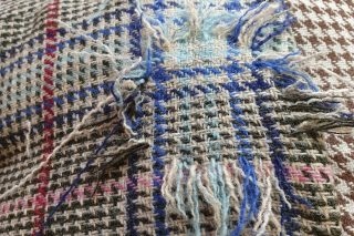Plaid fabric being reweaved