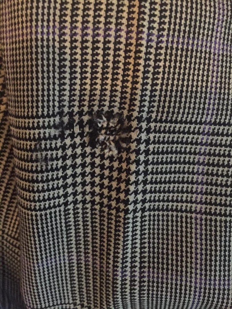 Houndstooth check with hole damage