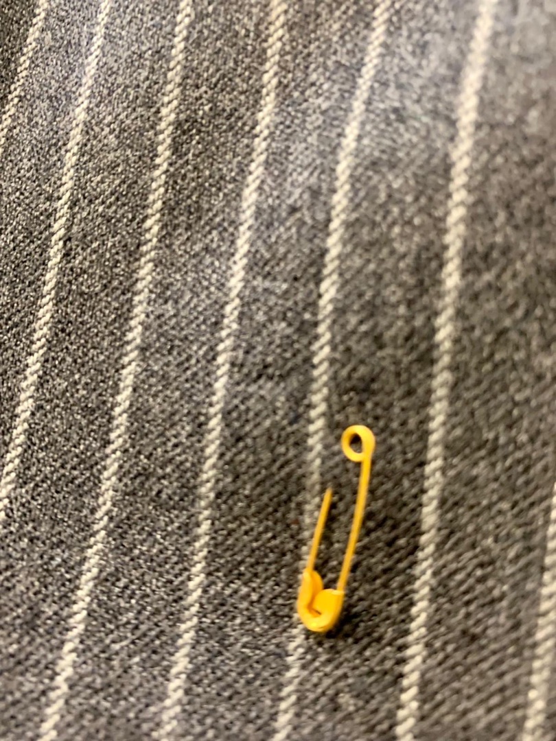 Grey pinstripe suit after invisible mend